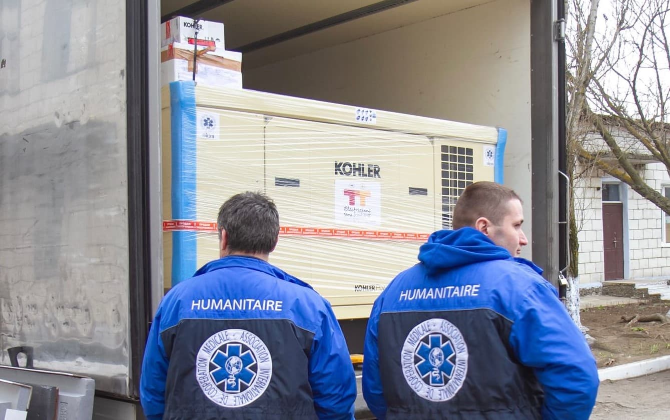 Humanitarians waiting for a Kohler delivery for the NGO Electricians without borders